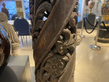 A pair of reticulated carved oak Corinthian columns with cherub heads and vines, 17th C.