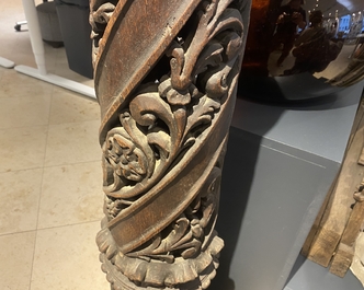 A pair of reticulated carved oak Corinthian columns with cherub heads and vines, 17th C.