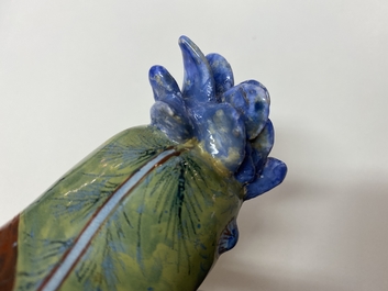 A polychrome Dutch Delft model of a parrot on a ring, 18th C.