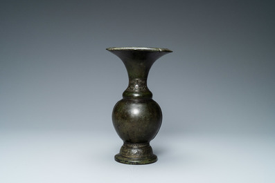 A Chinese bronze vase with incised taotie masks, Song/Yuan