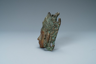 A bronze mask of a female deity, Tibet or South East Asia, 19th C.
