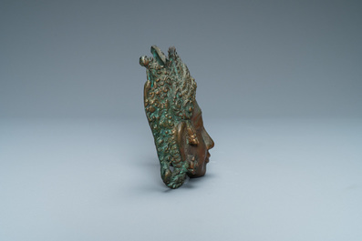 A bronze mask of a female deity, Tibet or South East Asia, 19th C.