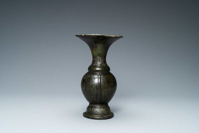 A Chinese bronze vase with incised taotie masks, Song/Yuan