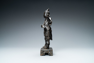 A Chinese bronze figure of a servant, Ming