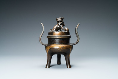 A Chinese partly gilded bronze tripod censer and cover, Ming