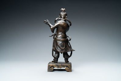 A Chinese bronze figure of a servant, Ming