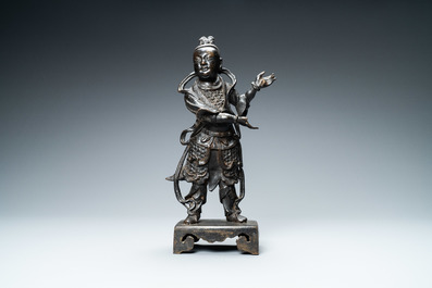 A Chinese bronze figure of a servant, Ming