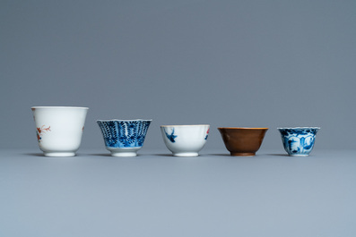 Twenty-four Chinese cups and twenty-five saucers in blue and white, famille rose, verte and Imari-style porcelain, Kangxi and later