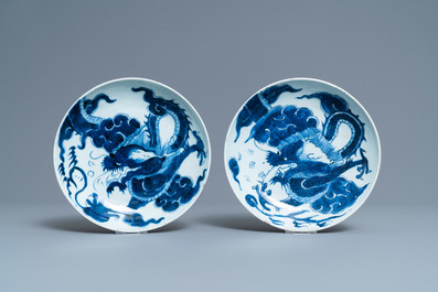 A pair of Chinese blue and white 'dragon' plates and a monochrome copper-red vase, Kangxi and later