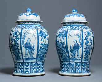 A pair of large Chinese blue and white covered vases, 19th C.