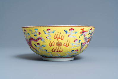 A Chinese yellow-ground famille rose 'dragon and phoenix' bowl, Xuantong mark and of the period