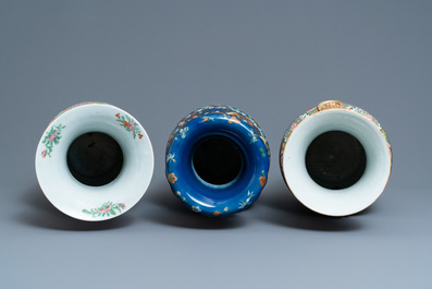 A pair of Chinese Canton famille rose vases and a blue-ground vase, 19th C.