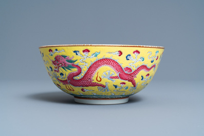 A Chinese yellow-ground famille rose 'dragon and phoenix' bowl, Xuantong mark and of the period