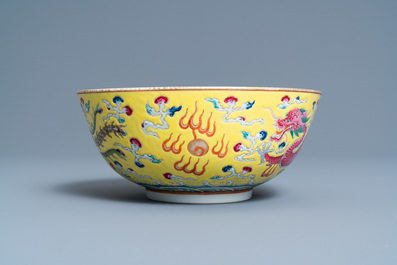 A Chinese yellow-ground famille rose 'dragon and phoenix' bowl, Xuantong mark and of the period