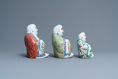 Five Chinese famille rose and white figures of Buddha, seal marks, 19/20th C.