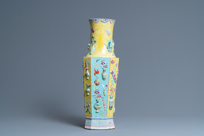 A Chinese famille rose vase with applied 'antiquities' design, 19th C.