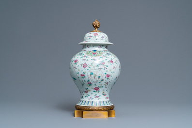 A Chinese famille rose vase and cover with gilt bronze mounts, 19th C.