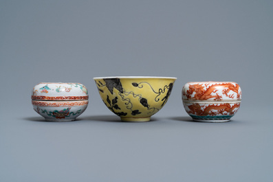 A Chinese Dayazhai yellow-ground bowl and two seal paste boxes, 19th C.