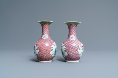 A pair of Chinese famille rose bottle vases with floral design, 19/20th C.