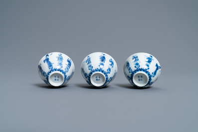 Three Chinese blue and white cups and two saucers, Kangxi