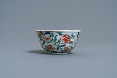 A Chinese famille rose armorial cup and saucer, Yongzheng
