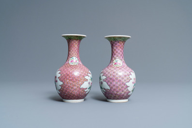 A pair of Chinese famille rose bottle vases with floral design, 19/20th C.