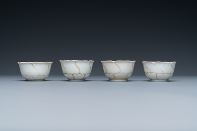 Four Chinese iron-red and gilt cups and saucers and a covered jug, Yongzheng/Qianlong