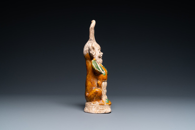 A Chinese sancai-glazed pottery 'earth spirit' figure, Tang