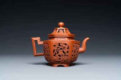 A Chinese reticulated double-walled Yixing stoneware teapot and cover, Kangxi