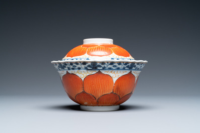 A Chinese iron-red, gilt and blue and white covered bowl on stand, 19th C.
