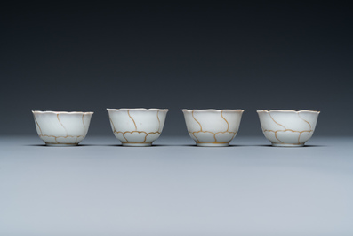 Four Chinese iron-red and gilt cups and saucers and a covered jug, Yongzheng/Qianlong