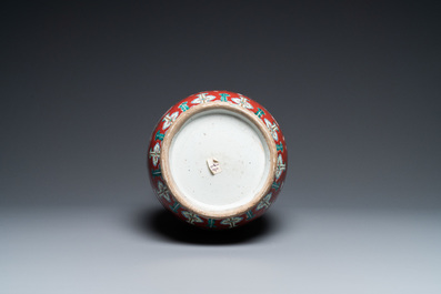 A Chinese famille rose ruby-ground vase, 19th C.