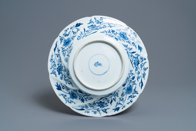 A Chinese blue and white gadrooned dish with phoenixes and monkeys, Kangxi