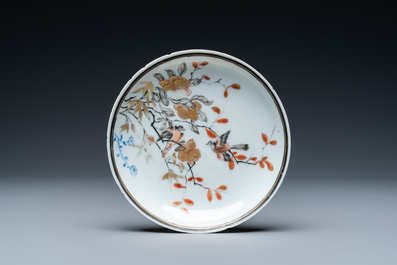 A Chinese grisaille, iron-red and gilt cup and saucer with birds near blossoming branches, Yongzheng