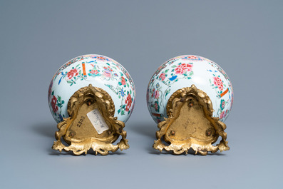 A pair of Chinese famille rose bowls on gilt bronze stand and a 'mandarin' mug, Qianlong