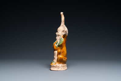 A Chinese sancai-glazed pottery 'earth spirit' figure, Tang