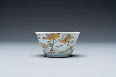 A Chinese grisaille, iron-red and gilt cup and saucer with birds near blossoming branches, Yongzheng