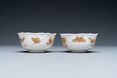 Three Chinese iron-red and gilt 'butterfly' saucers and two cups, Yongzheng