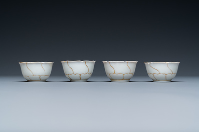 Four Chinese iron-red and gilt cups and saucers and a covered jug, Yongzheng/Qianlong