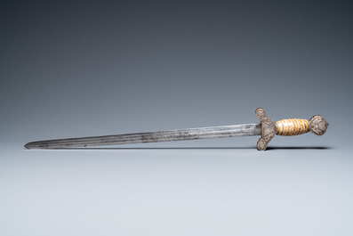 A Tibetan steel sword with silvered copper and mammoth tooth hilt, 19th C.