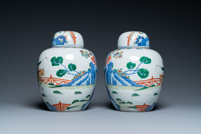 A pair of Chinese wucai jars and covers, Wanli mark, 19th C.