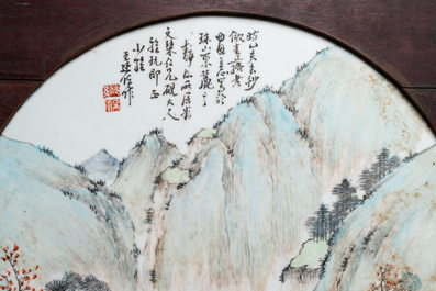 A round Chinese qianjiang cai 'landscape' plaque, signed Wang Shao Wei, 19th C.