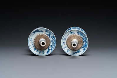 A pair of Chinese blue and white 'dragon' candlesticks, 19th C.