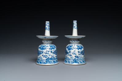 A pair of Chinese blue and white 'dragon' candlesticks, 19th C.