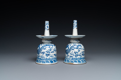 A pair of Chinese blue and white 'dragon' candlesticks, 19th C.