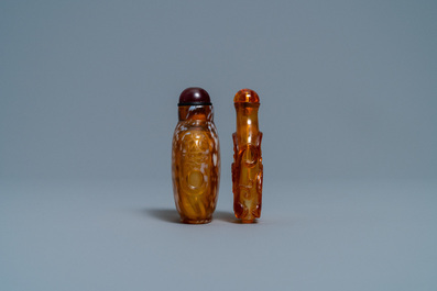 Two Chinese amber-simulating glass snuff bottles, 18/19th C.