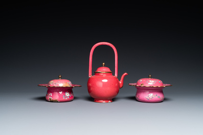 A Chinese ruby-ground Canton enamel teapot and a pair of covered bowls, Qianlong/Jiaqing