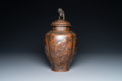 A Japanese hammered brass vase and cover, Meiji, 19th C.