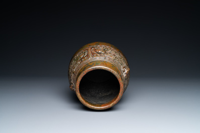 A Chinese bronze 'hu' vase with taotie masks, the base inscribed, 18/19th C.