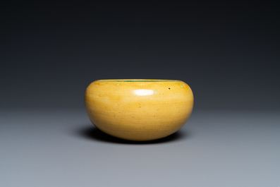 A Chinese monochrome yellow alms bowl with green interior, Kangxi